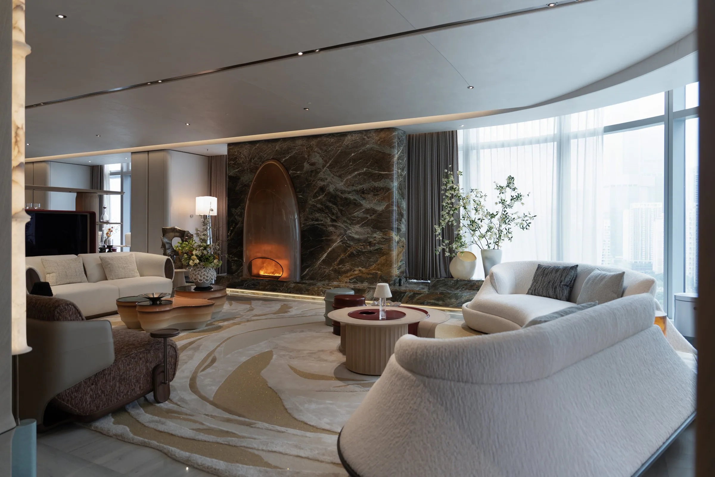 NEODIKO living room with seating arranged around a stone fireplace