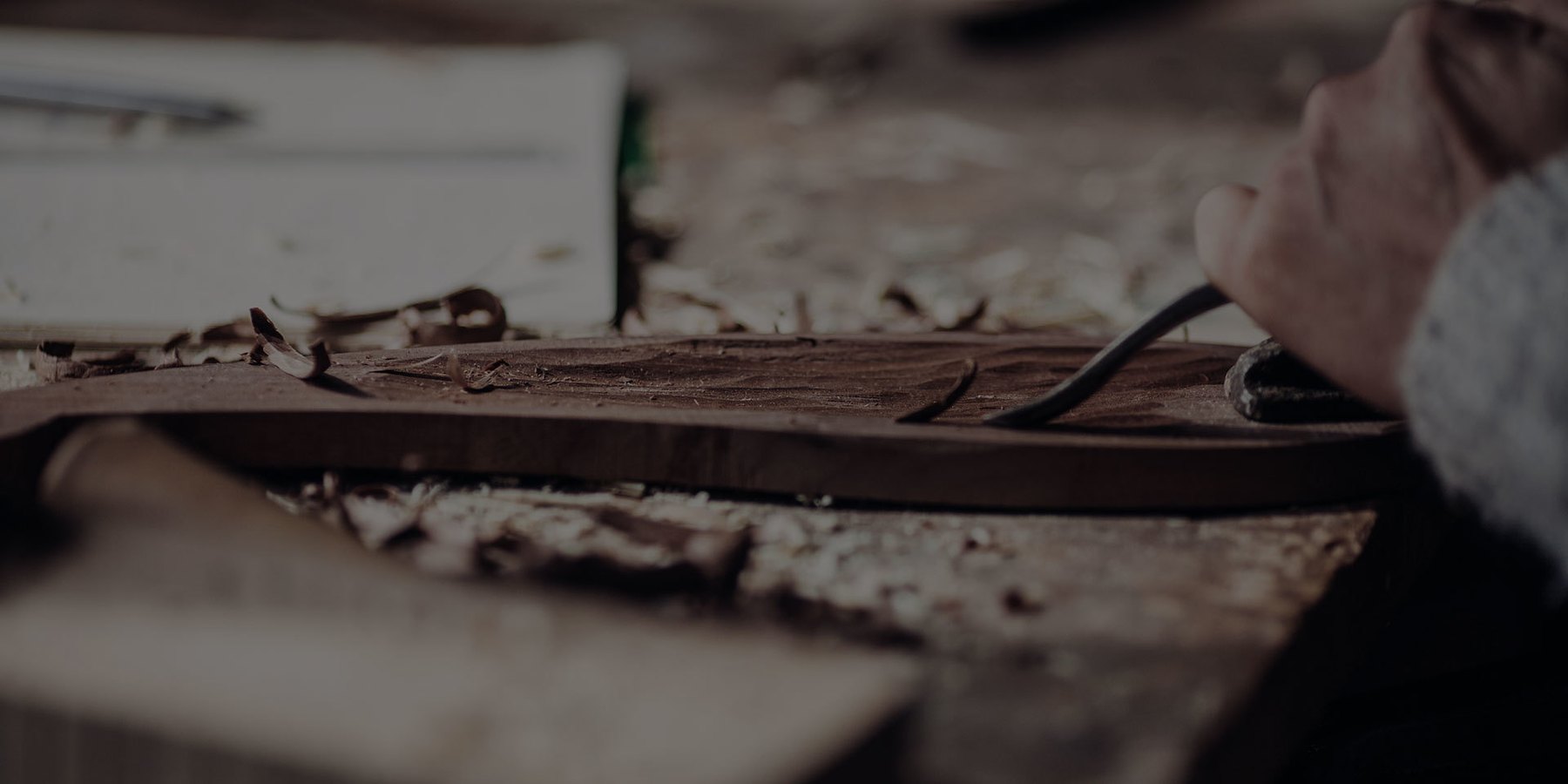 Close view of hand-finishing a wood surface