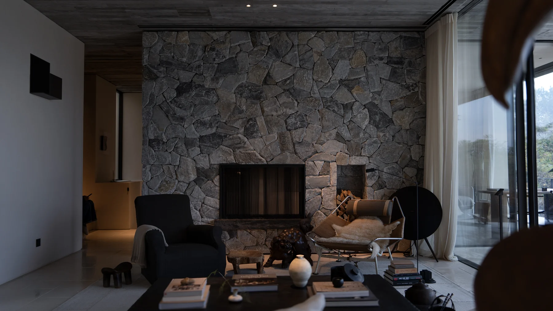 Wu Bin Residence living space and stone fireplace